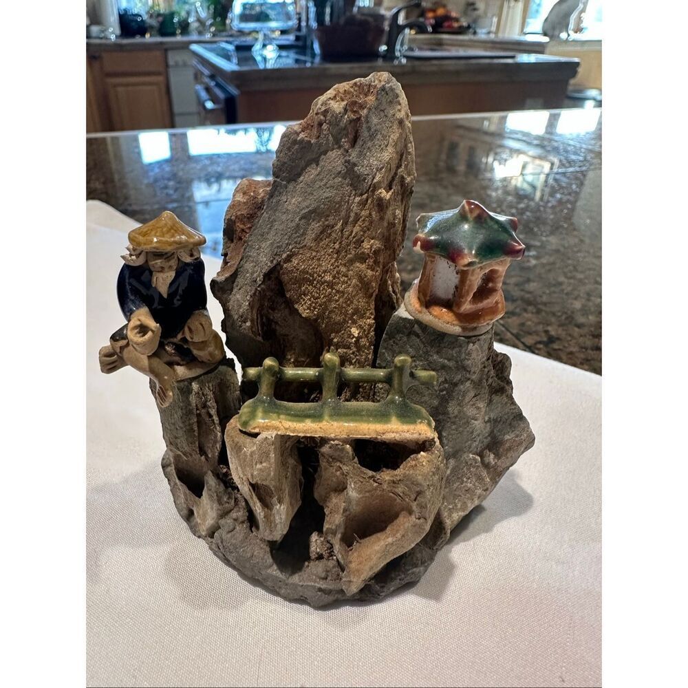 Miniature rock and ceramic fisherman scene